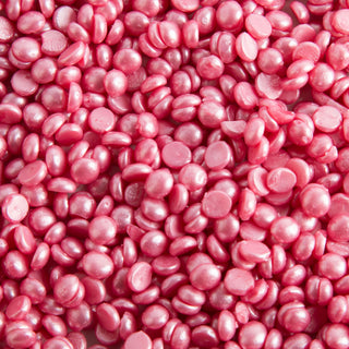 Pink Flex hard wax beads close-up